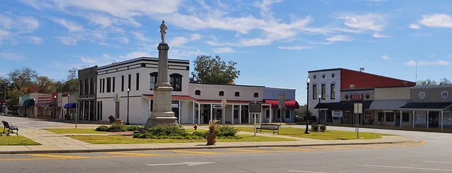 This is a photograph of the Barbour County Courthouse Square in Clayton, Alabama.
