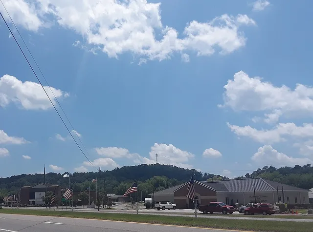 City Hall of Glencoe, Alabama (right), First Baptist Church of Glencoe (left), with Memorial Day flags in the foreground. Picture taken from across US Highway 431 on May 28th 2019