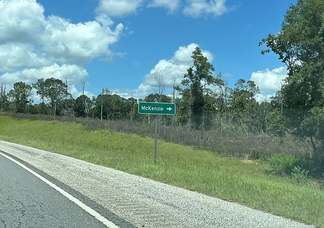 Road sign for McKenzie, Alabama