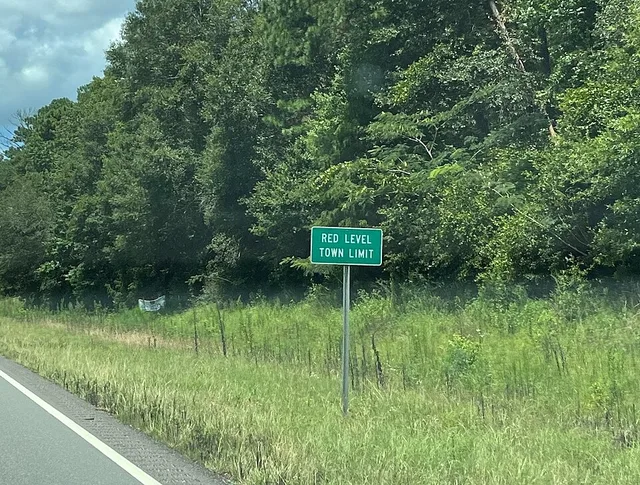 Town limit sign for Red Level, Alabama