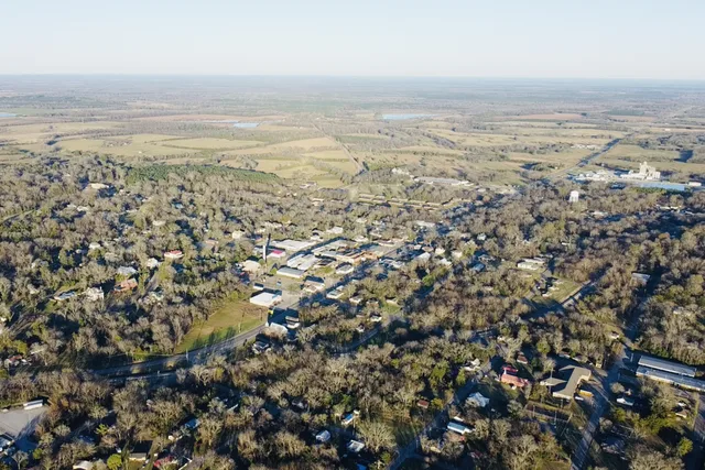 Aerial view of Uniontown, Alabama. View is looking to the northeast. Uniontown Municipal Building (City Hall) and Uniontown's Historic Water Tower is visible slightly left of cent...