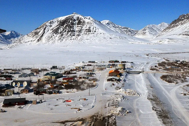 HIGH RECON – Flying above the small Alaskan village Anaktuvuk Pass, a pilot from A 1-207th Aviation Regiment, Alaska National Guard recons a safe landing zone. The Alaska National...