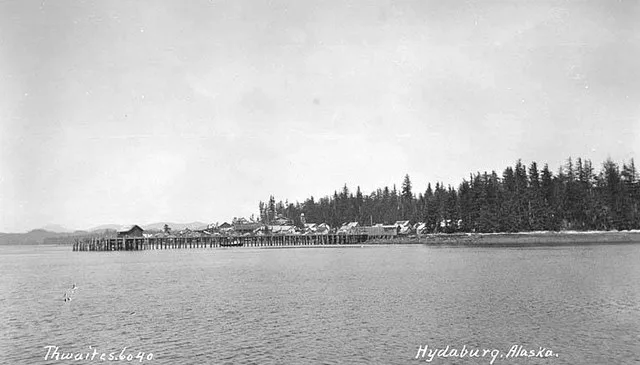 Caption on image: Hydaburg, Alaska PH Coll 247.980 Hydaburg is located on the southwest coast of Prince of Wales Island, 45 air miles northwest of Ketchikan. It lies 7 road miles...