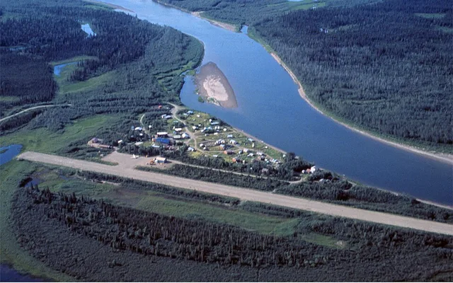 Aerial view of Kobuk, the airstrip, and the Kobuk River in the summer