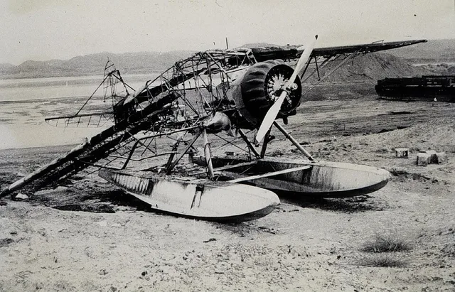 William Husemeyer's Stinson SR-5 Reliant, burned at Platinum, Alaska. Triangulation party of A. Newton Stewart. Southwest Alaska.