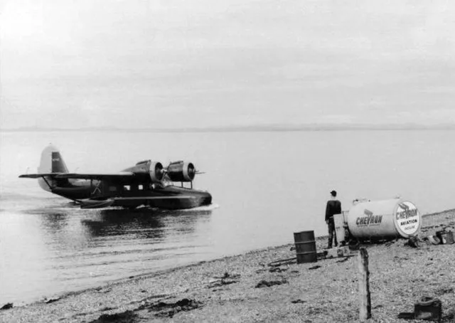 U.S. Fish & Wildlife Service Regional Director Clarence Rhodes approaches the beach in a Grumman G-21A Goose at Shageluk, Alaska (USA).