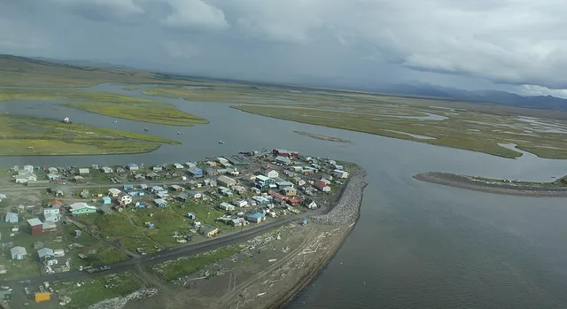 Native Village of Unalakleet. Unalakleet in Inupiat language is said to mean literally "Winds coming from the East." This is clearly visible in this image as the squall in the ima...