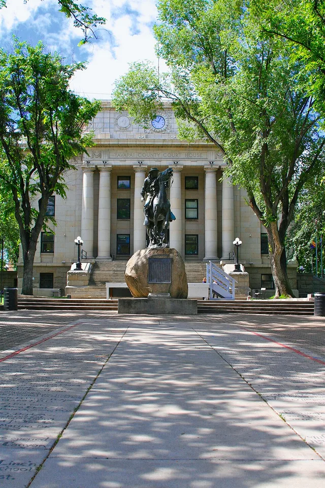 North side of the County Courthouse with Buckey O'Neil statue in foreground.