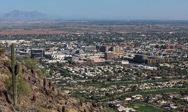 Aerial view of downtown Scottsdale, Arizona (pop. 241,361), viewed from Camelback Mountain in 2026.