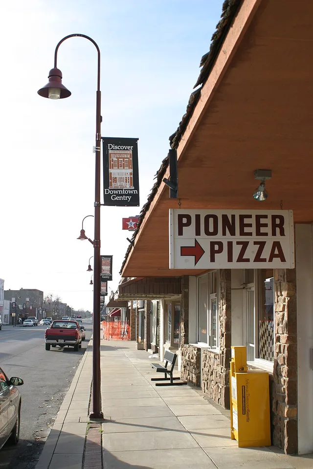 Main Street in Downtown Gentry, Arkansas, including the sign for well-known Pioneer Pizza restaurant