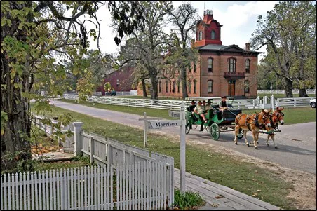 A horse and carriage riding through old Washington.