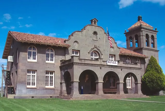 The NRHP-listed Nevada-California-Oregon Railway Co. General Office Building , also known as the N.C.O. Building. Scan from 35mm slide. Now an Elk's lodge .