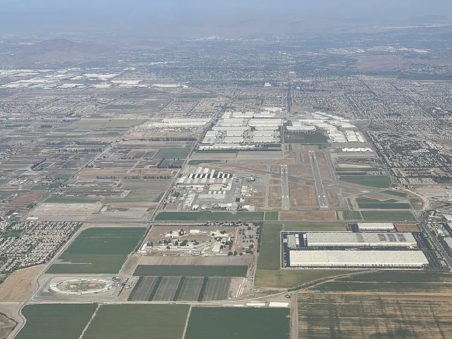 Chino Airport's three runways (which are 3/21, 8L/26R, 8R, 26L) can be seen in the center of the image. In the immediate foreground (right) and adjacent to the airport, two large...