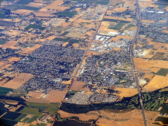 Aerial view of Galt, California in August 2018. The Union Pacific (ex-Southern Pacific) Fresno Subdivision runs through the center, with the former Amador Branch faintly visible...
