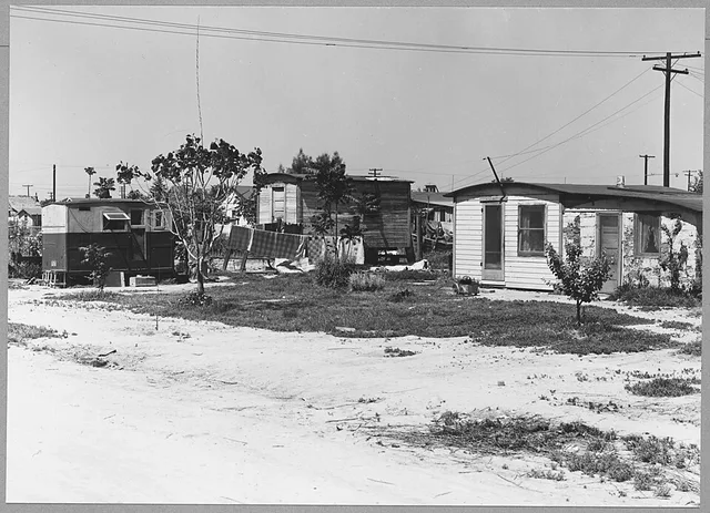 Scope and content: Full caption reads as follows: McFarland, Kern County, California. Homes in McFarland shacktown.