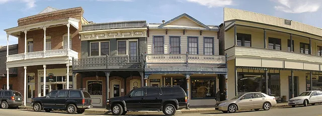 A view of Main Street (Old Highway 49) in Sutter Creek, CA. Shows historic buildings.
