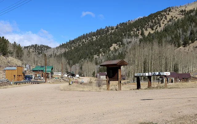 A view of the town of Bonanza, Colorado . The view is of 1st Avenue (road turning right) and Main Street (County Road LL56, the road going up the canyon). Bonanza is located in Sa...