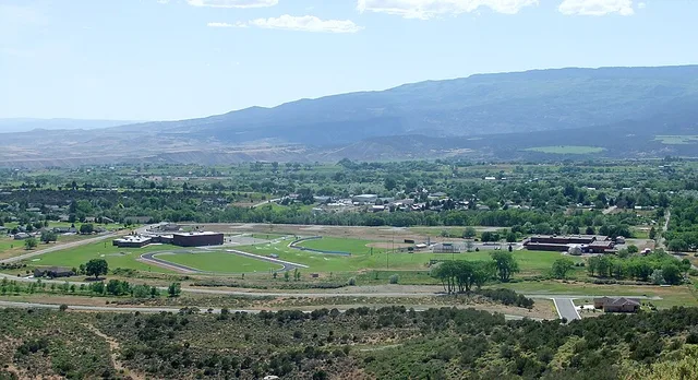 The town of Cedaredge, Colorado, as viewed from Cedar Mesa. The Cedaredge High School and Middle School are in the foreground.