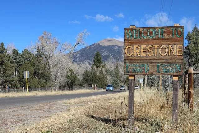 A sign that reads, "Welcome to Crestone, established 1880, elevation 8000," located on Birch Street in Crestone, Colorado.