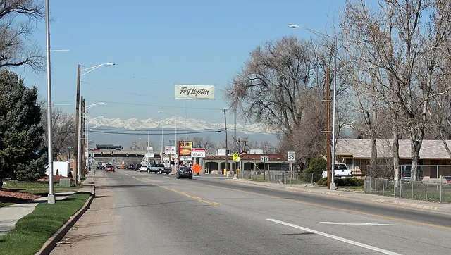 A view of Fort Lupton, Colorado. The view is looking towards the west on 1st Street, which is also Colorado State Highway 52. The freeway bridge in the background is U.S. Route 85.