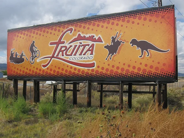This is the Fruita City sign seen along Interstate 70 before exit 17 turnoff. It highlights the four most notable activities that Fruita residents take part in