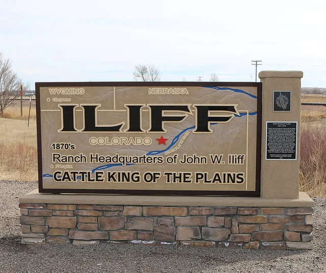 A sign marking the town of Iliff, Colorado . The text on the sign says, "Iliff Colorado, 1870's Ranch Headquarters of John W. Iliff, Cattle King of the Plains." The sign is locate...