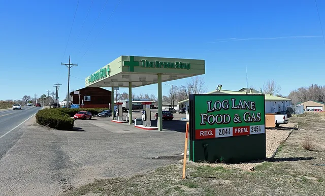 A view of Log Lane Village, in Morgan County, Colorado. The view is of Log Lane Food & Gas, a gas station. The station also houses a retail marijuana (cannabis) store called "The...