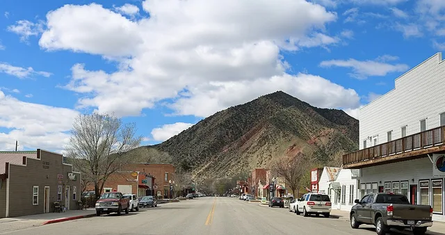 Main Street in New Castle, Colorado . The view is to the west, and the mountain is part of the Grand Hogback .