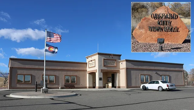 The town hall of Orchard City, Colorado , located at 9661 2100 Road, Orchard City, Colorado 81410. The inset shows the sign that's along the road at the bottom of the property's d...