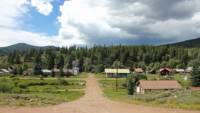A view of the town of Pitkin, Colorado. Quartz Creek flows under the small bridge at the center of the picture. The creek flows from right to left.
