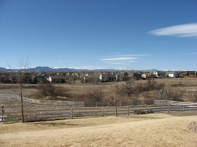 Houses in northeastern Westminster , Colorado , United States , with the Rocky Mountains in the background. The highest peak on the right side of the picture, underneath the lower...