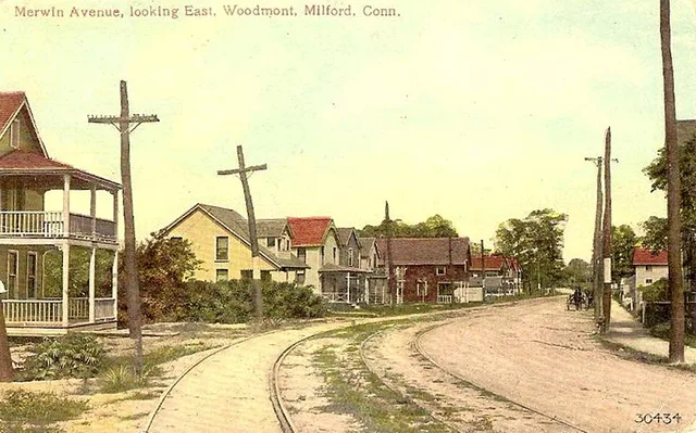 Divided back postcard of Merwin Avenue near Rock Street in the Woodmont portion of Milford, Connecticut. The streetcar track of the New Haven–Bridgeport line is visible.
