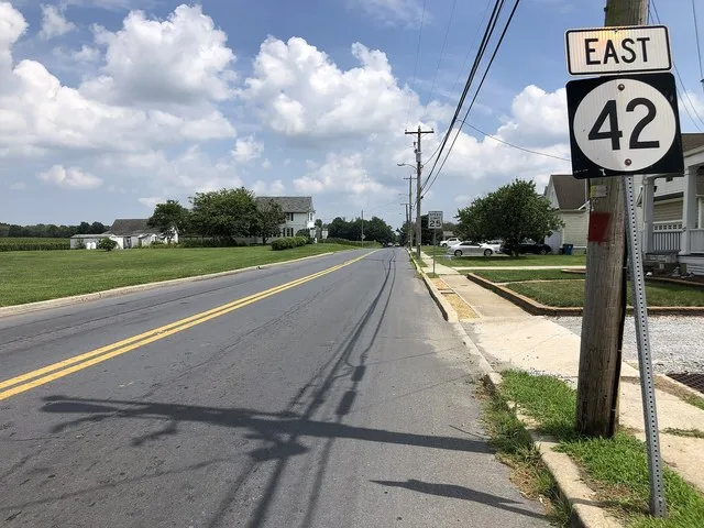 View east along Delaware State Route 42 (East Commerce Street) at Delaware State Route 300 (Main Street) in Kenton, Kent County, Delaware