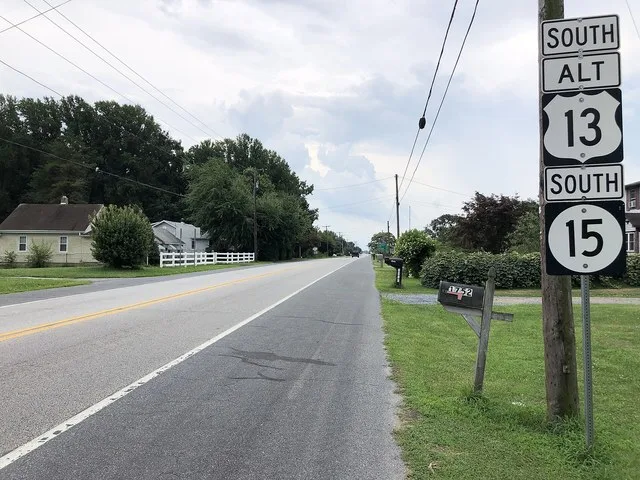 View south along U.S. Route 13 Alternate and Delaware State Route 15 (Upper King Road) at Delaware State Route 10 Alternate (Main Street) in Woodside, Kent County, Delaware