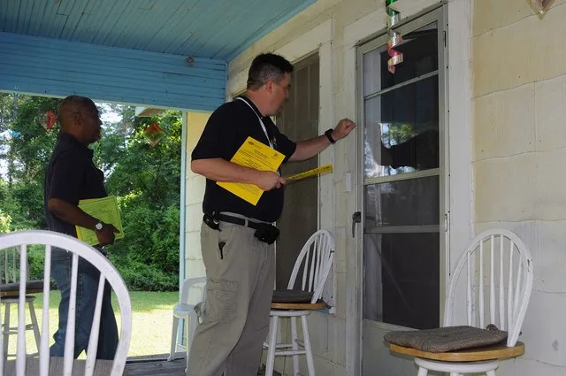 Caryville, FL, May 15, 2009 -- In Washington County, FEMA Community Relations(CR) Lead Jean Feguiere(R) and State Emergency Response Team(SERT) CR Lead Sam Bowman are providing do...