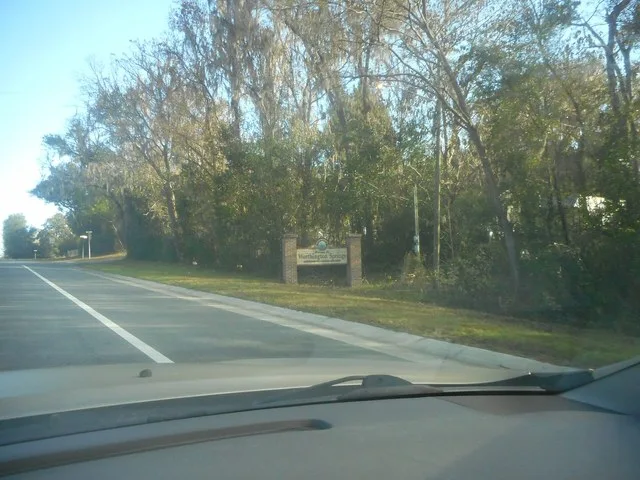 Northbound along Florida State Road 121 as it passes by the decorative northbound Welcome Sign for Worthington Springs, Florida . This sign is nowhere near MUTCD-compliant, and do...