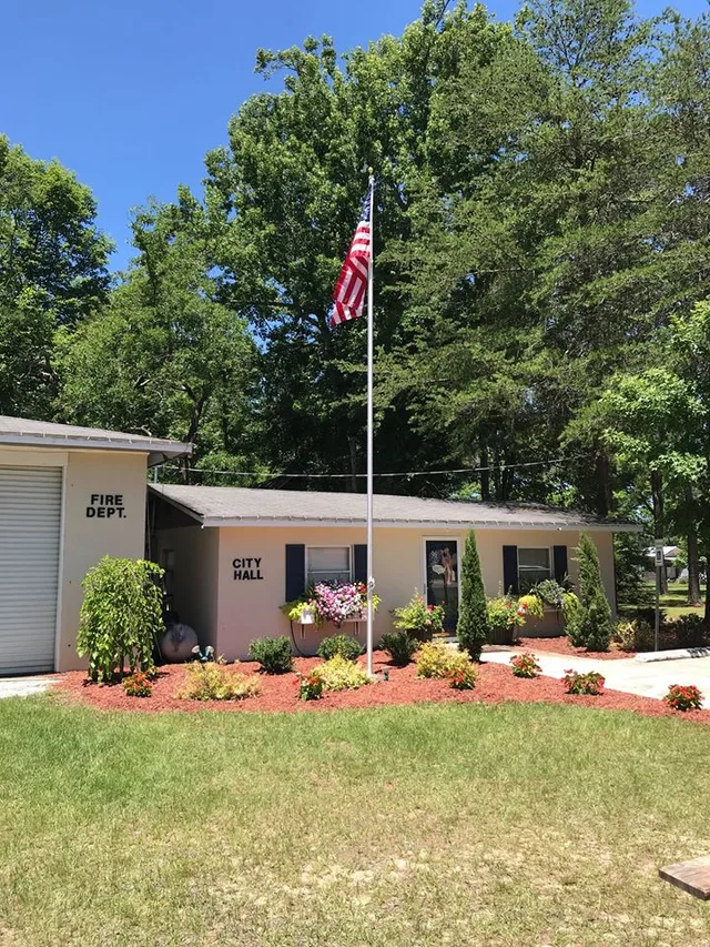 This is a picture of the city hall and fire station of the City of Edge Hill, Georgia right after the dedication of a new flag pole.