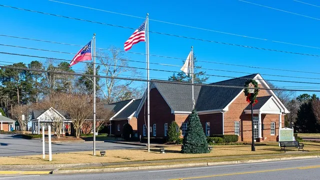 City Hall of Grayson, Georgia. Flags are (L to R) Georgia state flag, US Flag, and Grayson city flag.