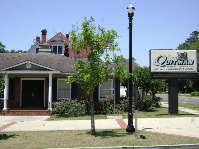 Quitman City Hall in Quitman, Brooks County, Georgia. The building is located on the southwest corner of W. Screven St. (US-84) and S. Court St. (US-221).