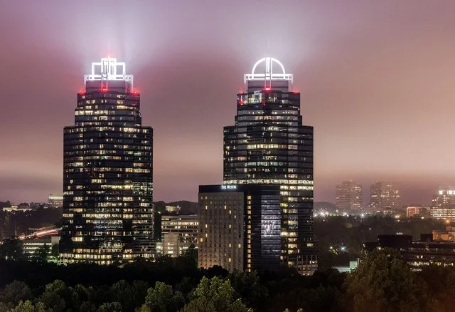 Concourse Corporate Center V and VI, but are known locally as "the King and Queen towers" at night. Atlanta, GA, USA.