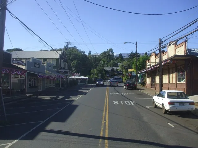 Looking up on Baldwin Ave. towards the Baldwin Ave/Makawao Ave/Olinda Road Intersection in Makawao. Komoda Store & Bakery is to the right of the picture (Off White/Brown Building).