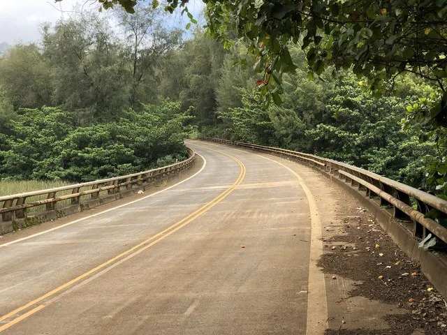 View west along Hawaii State Route 560 (Kuhio Highway) as it crosses the Lumahaʻi River in Wainiha, Kauai, Hawaii