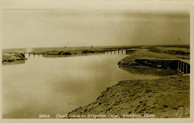 Image Title: Aberdeen-Springfield Canal Check Gates Date: c.1920 Place: Aberdeen, Idaho Description/Caption: 3059A Check Gates on Irrigation Canal, Aberdeen, Idaho Medium: Real Ph...