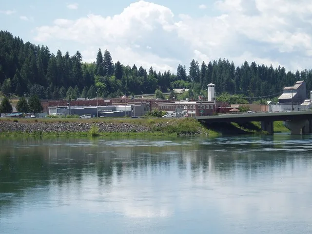 "The town of Bonners Ferry lies between dense conifer forests and the waters of Kootenai River."