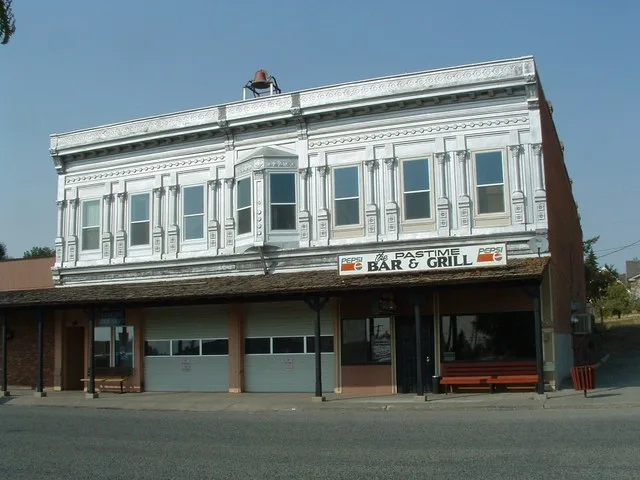 Vollmer Building is presently used by the Genesee Fire Department and a Bar and Grill. It is not clear if the upper floor is in use. A fire bell has been installed on the front pa...