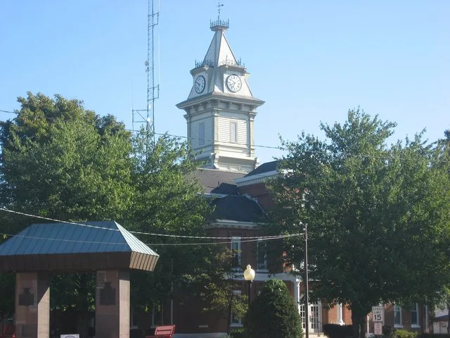 Southern and western sides of the Edwards County Courthouse , located along Illinois Routes 15 / 130 on Courthouse Square in downtown Albion , Illinois , United States . It was bu...