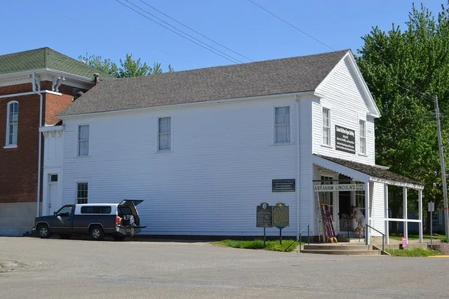 Northern side and front of the Col. Matthew Rogers Building , located at 200 S. Main Street in Athens , Illinois , United States . Built in 1832, it is listed on the National Regi...