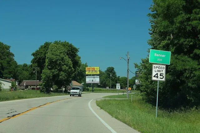 Sign for the village of Banner, Illinois on U.S. Route 24 .