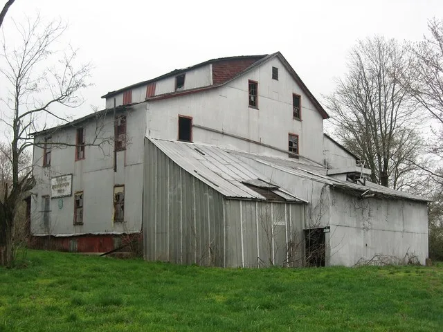 Front and eastern side of the Old Morrison Mill , located at the junction of Second and Mill Streets in Burnt Prairie , Illinois , United States . Built in 1891, it is listed on t...