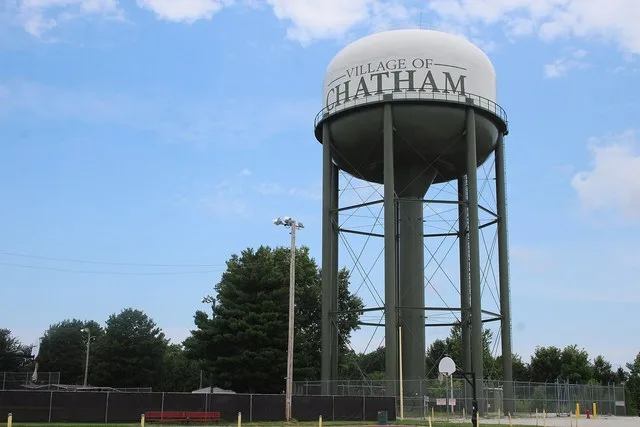 Water Tower of Chatham, Illinois , with basketball court of Jaycee Park in foreground.